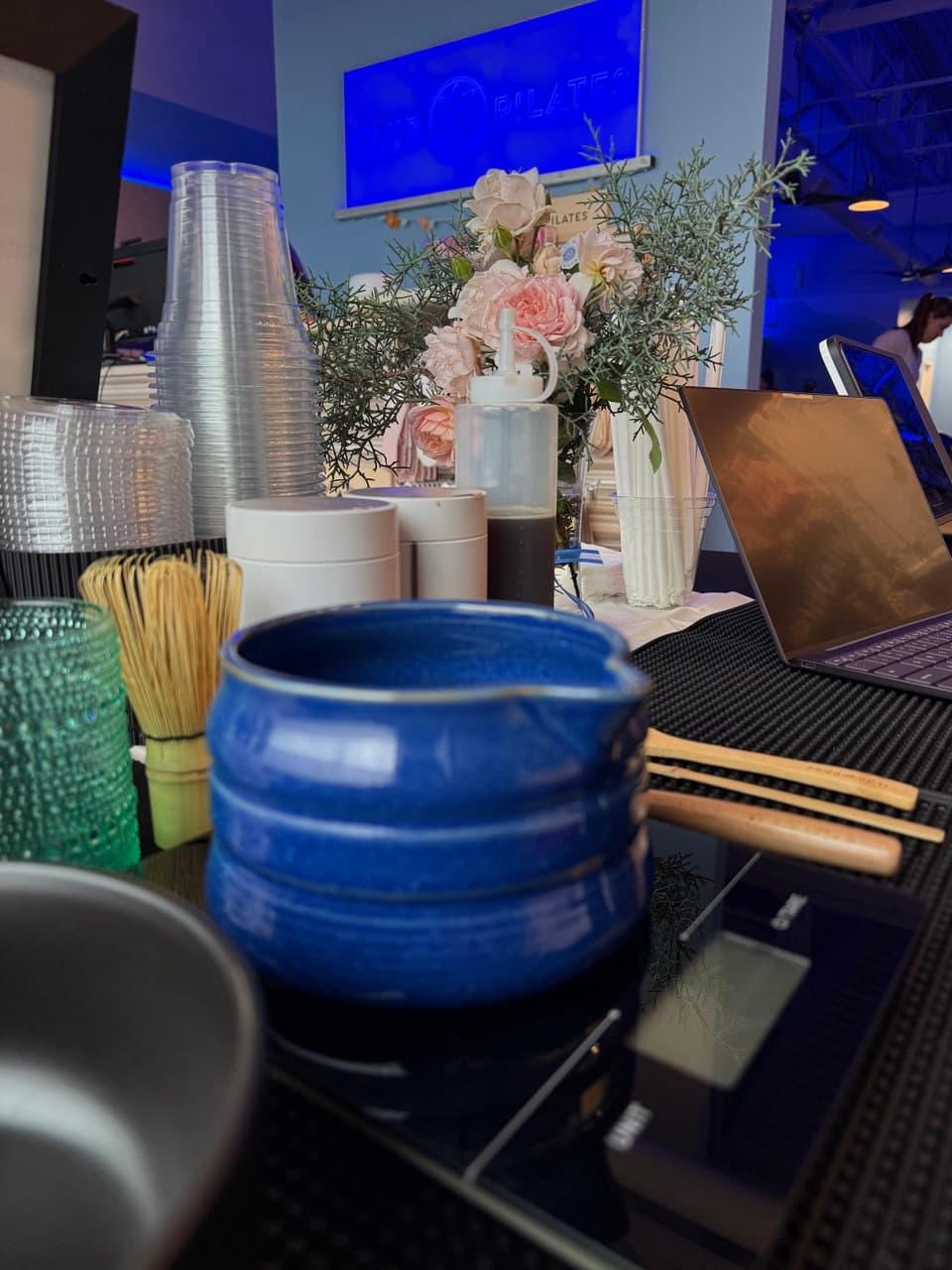 a bowl of matcha on a scale at a popup